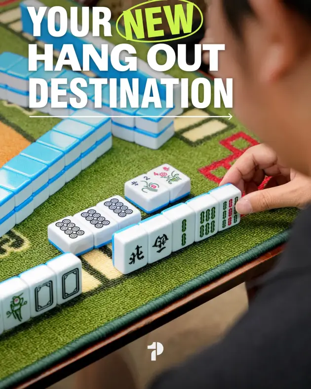 Mahjong tiles on a green table