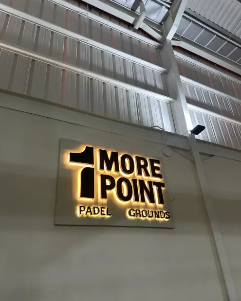 Illuminated 1More Point sign